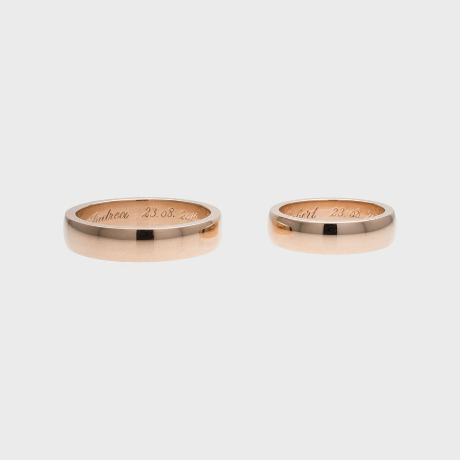 Domed red gold wedding rings with hand engraving by RINGKING Max Grün